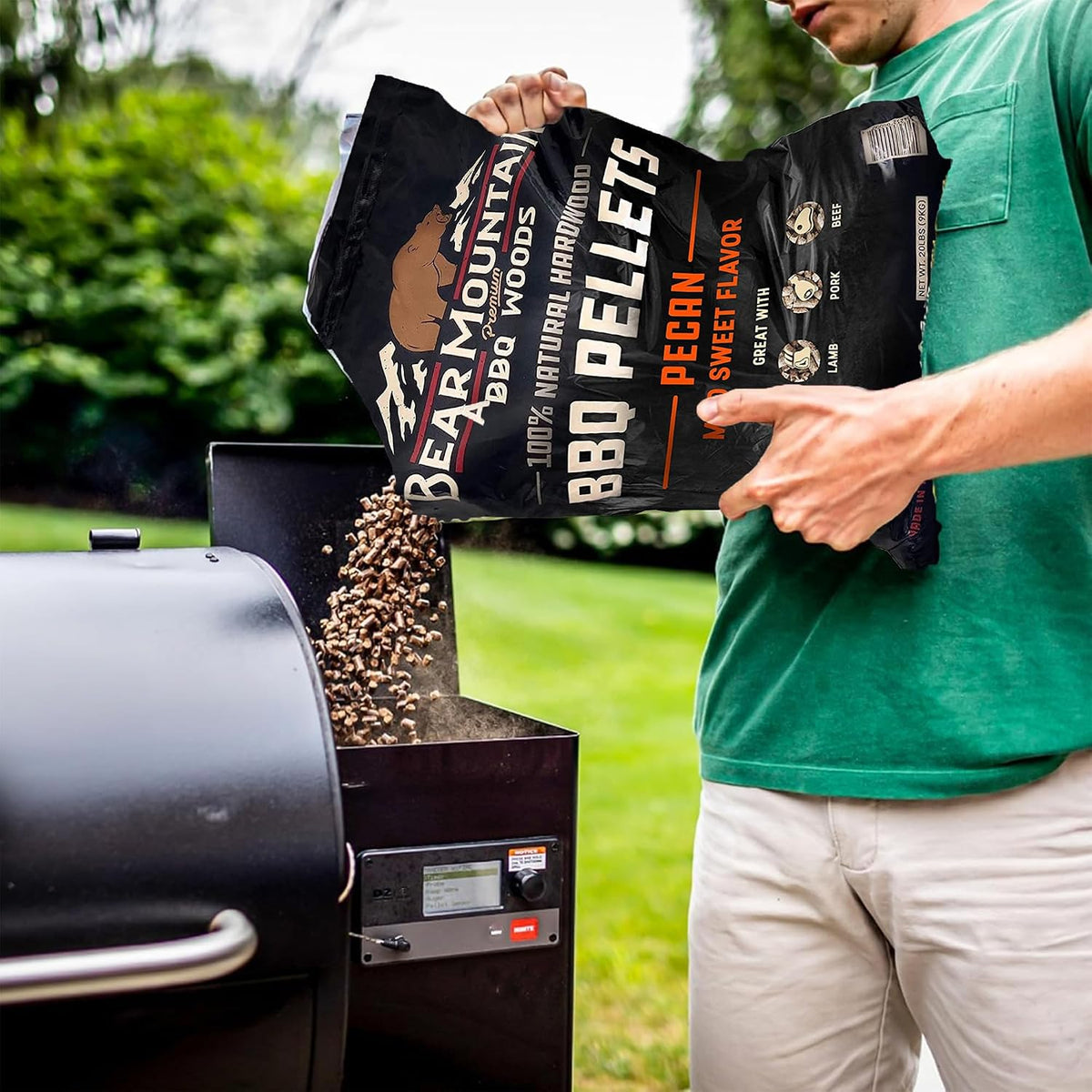 Bear Mountain — Pecan pellets being poured into a grill hopper